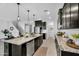 Well-appointed kitchen with stainless-steel appliances, granite countertops, a large island, and ample cabinet space at 13553 N 141St Ln, Surprise, AZ 85379