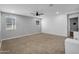 Spacious loft area featuring neutral decor, carpet flooring, and abundant natural light at 13553 N 141St Ln, Surprise, AZ 85379