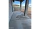 View of the back patio area, backyard, and block wall at 14861 S Capistrano Rd, Arizona City, AZ 85123