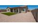 Cozy backyard with a covered patio, artificial turf and desert rock at 14861 S Capistrano Rd, Arizona City, AZ 85123