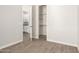 A view from a bright bedroom toward the walk-in closet and kitchen at 14861 S Capistrano Rd, Arizona City, AZ 85123