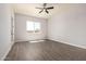 Bright bedroom with large window, tiled floors and neutral paint at 14861 S Capistrano Rd, Arizona City, AZ 85123