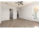 Primary bedroom with tiled floors leading to bath and balcony at 14861 S Capistrano Rd, Arizona City, AZ 85123