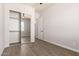 Cozy bedroom with a mirrored closet and wood-look flooring at 14861 S Capistrano Rd, Arizona City, AZ 85123