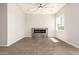 Modern living room features a sleek fireplace, neutral walls, and stylish tiled floors at 14861 S Capistrano Rd, Arizona City, AZ 85123