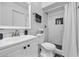 Bathroom featuring a shower over tub, tiled walls, and vanity with storage at 1510 W 7Th Dr, Mesa, AZ 85202