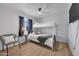 Bright bedroom with bunk bed and chair with a window overlooking the neighborhood at 1510 W 7Th Dr, Mesa, AZ 85202