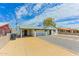 A single-story home featuring a carport and drought-resistant landscaping at 1510 W 7Th Dr, Mesa, AZ 85202