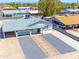 Aerial view of charming single-story home with a carport, desert landscaping, and modern exterior paint at 1510 W 7Th Dr, Mesa, AZ 85202