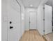 Hallway with neutral flooring and white doors, providing access to various rooms in the home at 1510 W 7Th Dr, Mesa, AZ 85202