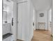 Hallway leading to multiple rooms including a powder room with marble-look vanity at 1510 W 7Th Dr, Mesa, AZ 85202