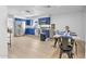 Bright kitchen with stainless steel appliances and dining area with seating and bar at 1510 W 7Th Dr, Mesa, AZ 85202