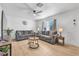 Bright living room with wood floors, comfortable seating, and neutral decor at 1510 W 7Th Dr, Mesa, AZ 85202