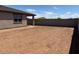 This backyard offers a blank canvas, bordered by a block wall, offering privacy at 16071 W Remuda Dr, Surprise, AZ 85387