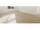 Bright, airy bedroom featuring tile floors, white walls, and natural light at 16071 W Remuda Dr, Surprise, AZ 85387