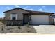 Charming single-story home featuring neutral paint, desert landscaping, and an attached two-car garage at 16071 W Remuda Dr, Surprise, AZ 85387