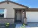 Charming single-story home featuring neutral paint, desert landscaping, and an attached two-car garage at 16071 W Remuda Dr, Surprise, AZ 85387