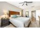Relaxing bedroom with a spacious layout, ceiling fan, and access to an adjacent bathroom at 16384 W Salado Creek Dr, Surprise, AZ 85387
