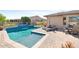 Inviting pool and patio area, ideal for relaxation and outdoor entertainment at 16384 W Salado Creek Dr, Surprise, AZ 85387