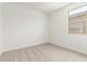 Well lit carpeted bedroom with a window at 17043 W Fetlock Trl, Surprise, AZ 85387