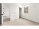 Bedroom featuring a window and closet with sliding doors at 17043 W Fetlock Trl, Surprise, AZ 85387