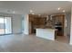 Open kitchen featuring stainless steel appliances, center island and view to the backyard at 17043 W Fetlock Trl, Surprise, AZ 85387