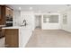 A kitchen featuring a large island with white countertops and wood paneled cabinets at 17043 W Fetlock Trl, Surprise, AZ 85387