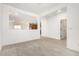 Open-concept living area with a view of the adjacent rooms and tile flooring at 17043 W Fetlock Trl, Surprise, AZ 85387