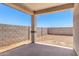 Covered patio with block fencing at 17043 W Fetlock Trl, Surprise, AZ 85387