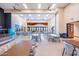 Large ballroom featuring tables, chairs, windows, and a small stage area at 17244 W West Wind Dr, Surprise, AZ 85387