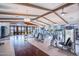 Spacious gym with modern exercise equipment, high ceilings, and views of the lake at 17244 W West Wind Dr, Surprise, AZ 85387