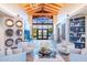 Bright lobby area with high ceilings, lake views, stylish furniture, and elegant decor at 17244 W West Wind Dr, Surprise, AZ 85387