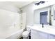 Clean bathroom featuring a shower-tub combo, tile surround, and modern vanity at 1961 N Hartford St # 1149, Chandler, AZ 85225