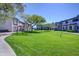 Community green space with mature trees and well-maintained landscaping at 1961 N Hartford St # 1149, Chandler, AZ 85225