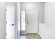 Bright entryway featuring a white door and minimalist design, creating a clean and modern look at 1961 N Hartford St # 1149, Chandler, AZ 85225