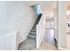 Hallway with carpeted stairs leading to a spacious living area, blending comfort and style at 1961 N Hartford St # 1149, Chandler, AZ 85225