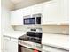 Modern kitchen featuring stainless steel appliances, white cabinets, and marble-look countertops at 1961 N Hartford St # 1149, Chandler, AZ 85225