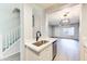 Stylish kitchen with stainless steel sink and open layout, seamlessly connecting to the living area at 1961 N Hartford St # 1149, Chandler, AZ 85225