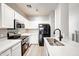 Well-equipped kitchen featuring white cabinets, modern appliances, and ample counter space at 1961 N Hartford St # 1149, Chandler, AZ 85225