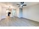 Open-concept living area showcasing wood-look floors connecting to the kitchen and stairway at 1961 N Hartford St # 1149, Chandler, AZ 85225