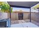 Covered patio with a view of the walled yard and a rock landscape at 1961 N Hartford St # 1149, Chandler, AZ 85225