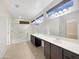 Bright bathroom with double vanity, a glass-enclosed shower, and a large mirror at 19982 N Tealstone Dr, Surprise, AZ 85374