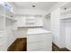 Well-organized walk-in closet with custom shelving, drawers, and ample storage space at 19982 N Tealstone Dr, Surprise, AZ 85374