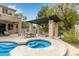 Backyard with a pergola, outdoor fire pit, spa and comfortable seating at 2024 E Taurus Pl, Chandler, AZ 85249