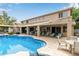 Backyard with a private pool, a covered seating area and mature landscaping at 2024 E Taurus Pl, Chandler, AZ 85249