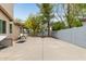 Spacious backyard featuring a basketball hoop and concrete patio, perfect for outdoor activities and entertaining at 2024 E Taurus Pl, Chandler, AZ 85249