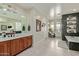 Bright bathroom boasts double sinks, tile flooring, soaking tub, and modern fixtures at 2024 E Taurus Pl, Chandler, AZ 85249