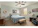 Calming bedroom with a ceiling fan, comfortable carpet, and blue accents at 2024 E Taurus Pl, Chandler, AZ 85249