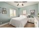 Cozy bedroom with fresh paint, a ceiling fan, a bright window, and neutral decor at 2024 E Taurus Pl, Chandler, AZ 85249