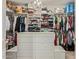 Spacious walk-in closet with ample storage, built-in shelving, and a chandelier at 2024 E Taurus Pl, Chandler, AZ 85249